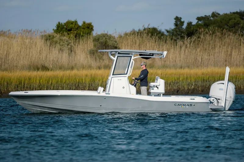 Slide: The Image of 2026 Caymas 26 HB boat on calm water. - 5