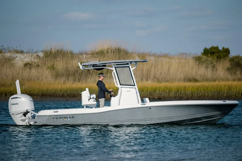 Slide: The Image of 2026 Caymas 26 HB boat on calm water. - 8