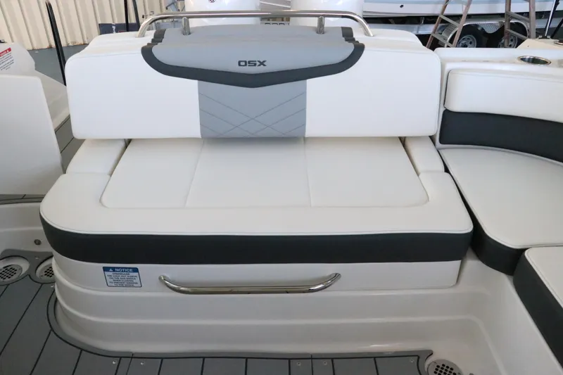 Slide: The Image of 2026 Chaparral 280 OSX boat interior with white and gray seating and speaker system. - 16