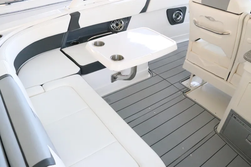 Slide: The Image of 2026 Chaparral 280 OSX boat interior with sink, countertop, and storage. - 21