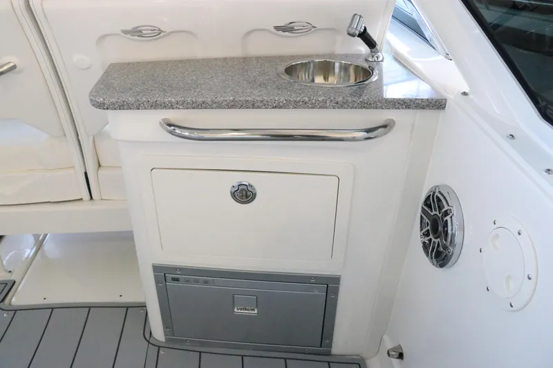 Slide: The Image of Open storage compartment on 2026 Chaparral 280 OSX boat, featuring sleek design and functionality. - 23