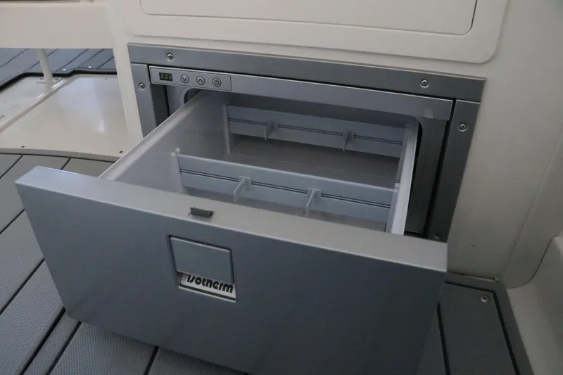 Slide: The Image of 2026 Chaparral 280 OSX boat interior with luxurious white and gray seating. - 26