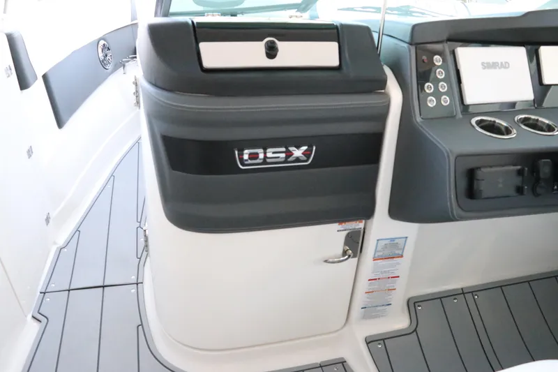Slide: The Image of Interior storage compartment of 2026 Chaparral 280 OSX boat, featuring sleek black design. - 37