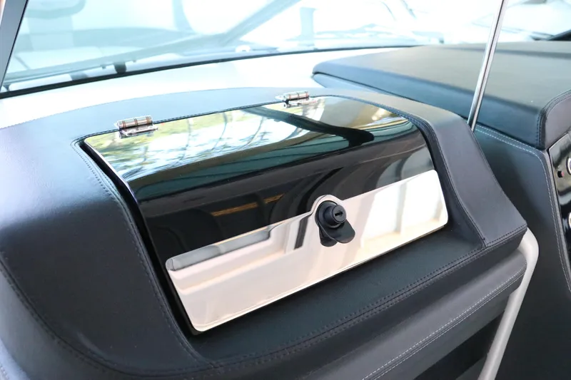 Slide: The Image of 2026 Chaparral 280 OSX cabin interior with sink and seating area. - 38