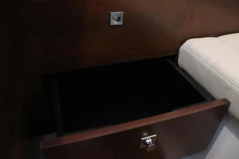 Slide: The Image of 2026 Chaparral 280 OSX interior seating with beige upholstery. - 45