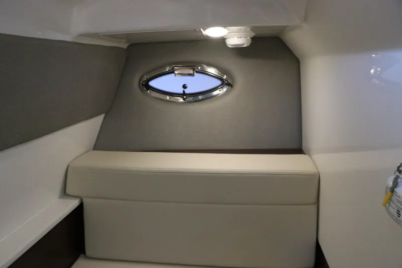 Slide: The Image of Interior of 2026 Chaparral 280 OSX boat with wood finish and seating. - 46