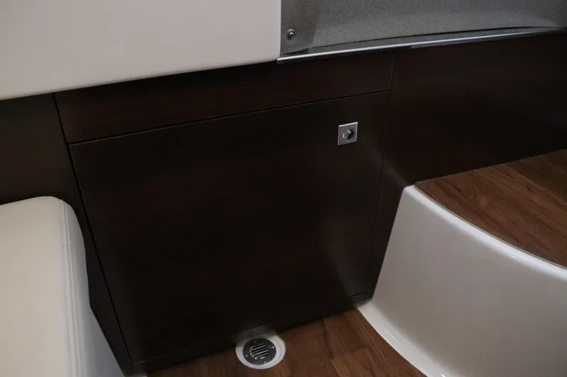 Slide: The Image of Control panel of Chaparral 280 OSX 2026 boat, showing water and waste levels. - 48