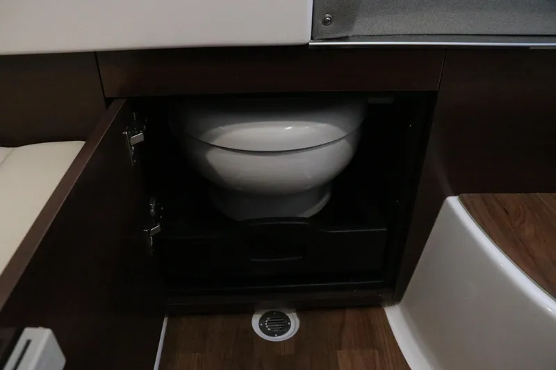 Slide: The Image of 2026 Chaparral 280 OSX boat interior with sleek dashboard and modern design. - 49