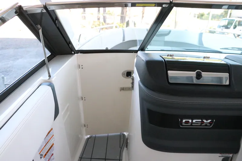 Slide: The Image of 2026 Chaparral 280 OSX boat interior with spacious seating and modern design. - 51