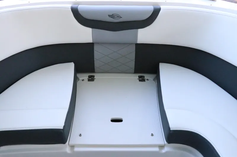 Slide: The Image of 2026 Chaparral 280 OSX boat interior with seating and table, featuring cup holders. - 56