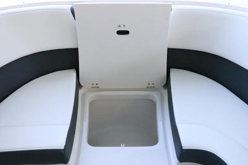 Slide: The Image of 2026 Chaparral 280 OSX boat deck with storage hatch and cushioned seating. - 57