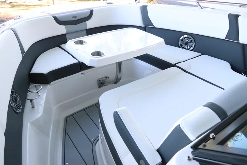 Slide: The Image of 2026 Chaparral 280 OSX anchor compartment with chain and tools. - 58