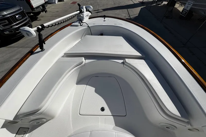 Slide: The Image of 2018 Chaos 21 Tarpon Bay boat with open storage compartments on deck. - 11