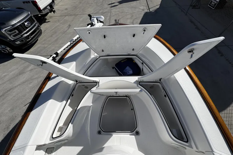 Slide: The Image of 2018 Chaos 21 Tarpon Bay boat with white interior and center console. - 12