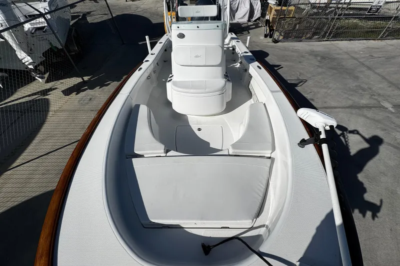 Slide: The Image of 2018 Chaos 21 Tarpon Bay boat seat storage compartment being opened. - 14