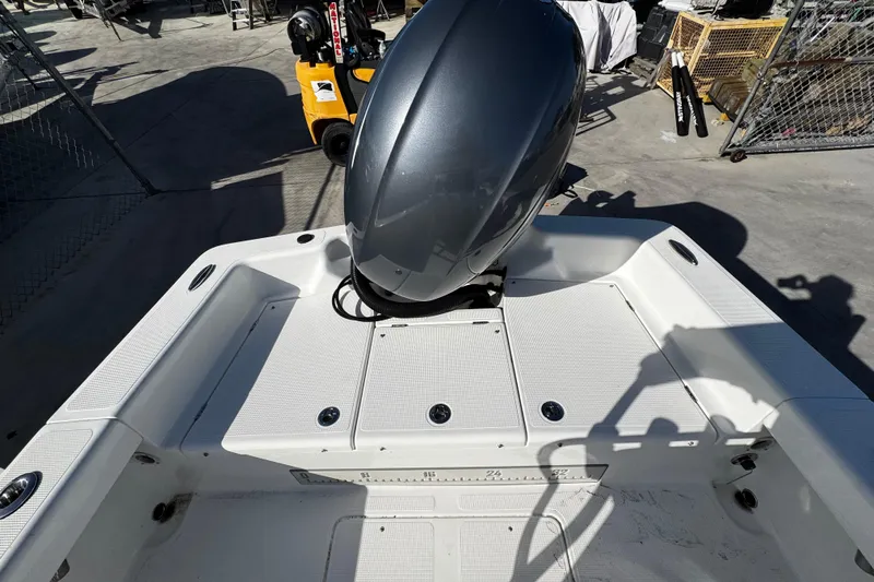 Slide: The Image of 2018 Chaos 21 Tarpon Bay boat interior with console and seating. - 16