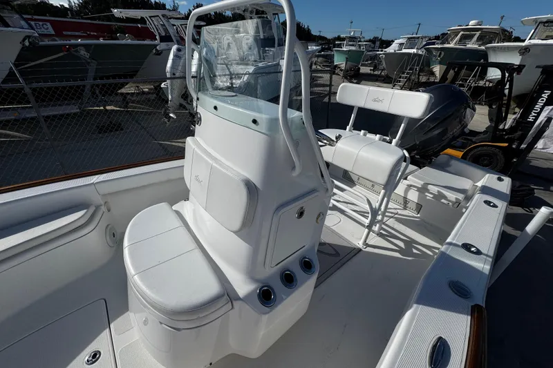 Slide: The Image of 2018 Chaos 21 Tarpon Bay boat interior compartment with open storage. - 17