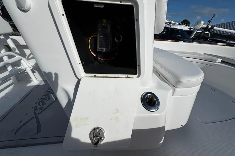 Slide: The Image of 2018 Chaos 21 Tarpon Bay boat interior with steering wheel and control panel. - 19