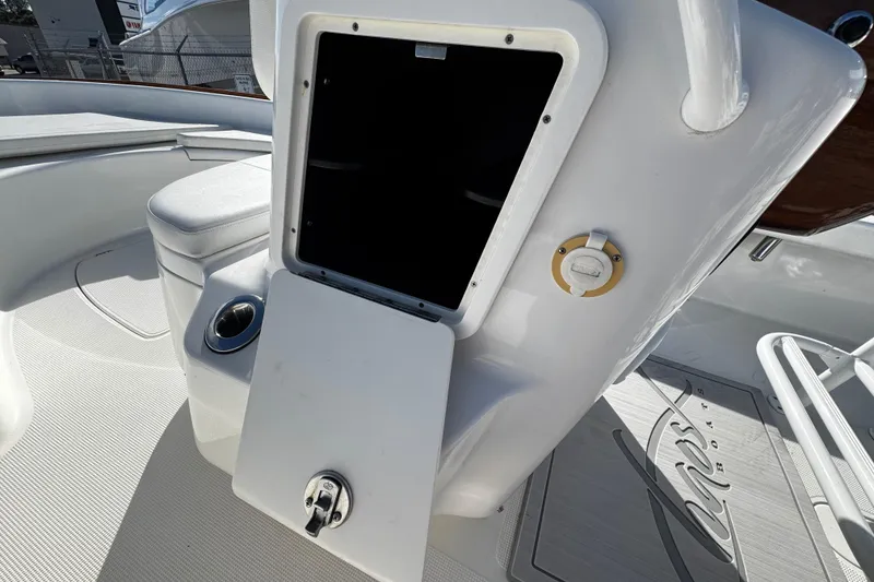 Slide: The Image of 2018 Chaos 21 Tarpon Bay boat interior with seating and trolling motor. - 28