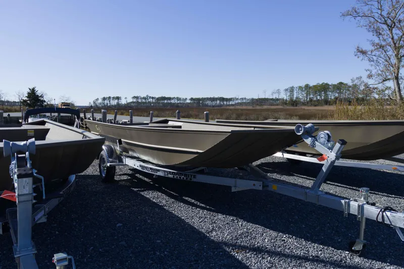 The Image of 2026 G3 Gator Tough 1860 VBW boat on trailer, outdoor display. - 0