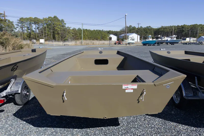 Slide: The Image of 2026 G3 Gator Tough 1860 VBW boat on trailer, outdoor display. - 2