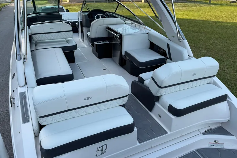 Slide: The Image of 2021 Regal 29 OBX boat interior with luxurious white seating and modern design. - 10