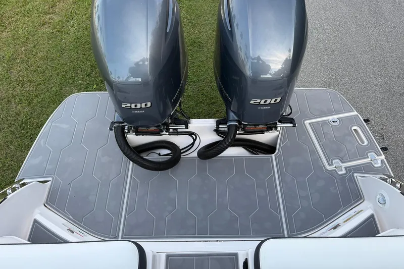 Slide: The Image of 2021 Regal 29 OBX boat with twin Yamaha 200 engines on a sleek deck. - 11