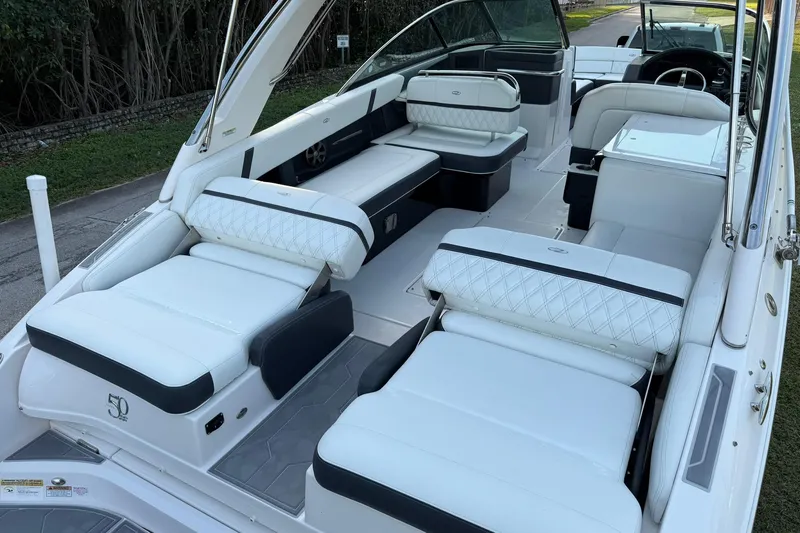 Slide: The Image of 2021 Regal 29 OBX boat interior with luxurious white seating and modern design. - 13