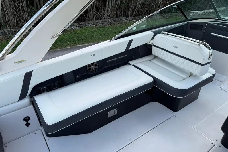 Slide: The Image of 2021 Regal 29 OBX boat interior with white seating and sleek design. - 15