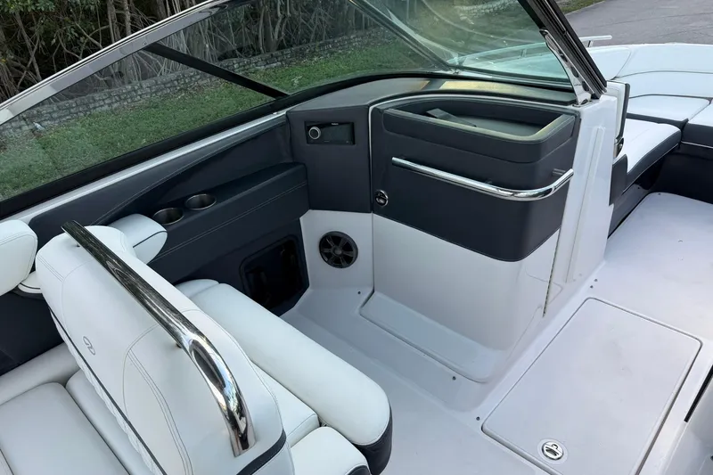 Slide: The Image of 2021 Regal 29 OBX boat interior with white seating and sleek design. - 19