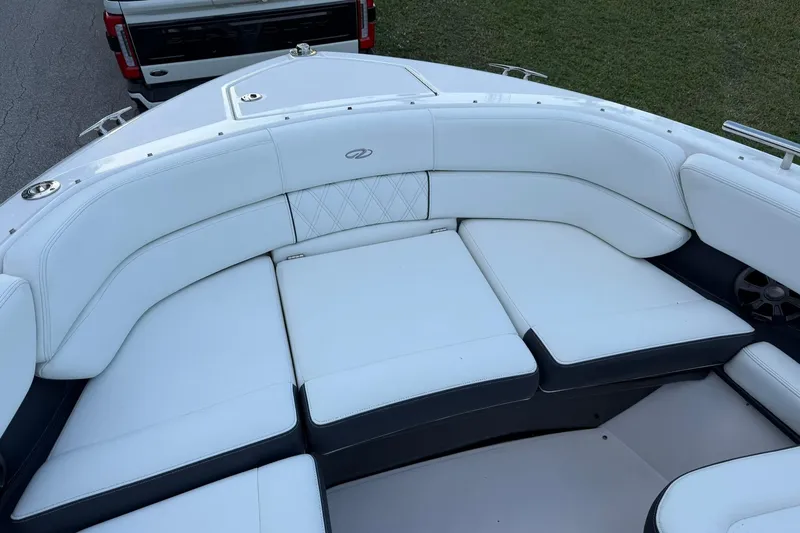 Slide: The Image of 2021 Regal 29 OBX boat with luxurious white seating and elegant design. - 24