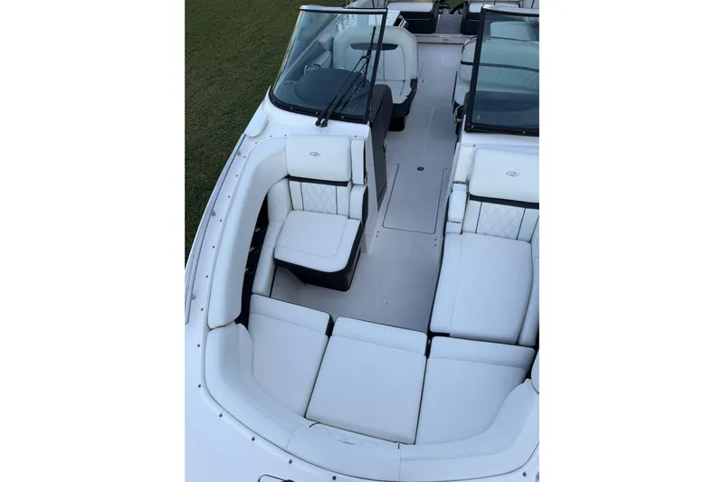 Slide: The Image of 2021 Regal 29 OBX boat interior with white seating and windshield. - 26