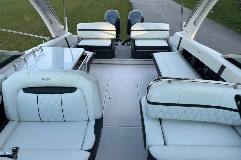 Slide: The Image of Luxurious interior of 2021 Regal 29 OBX boat with white seating and modern design. - 27
