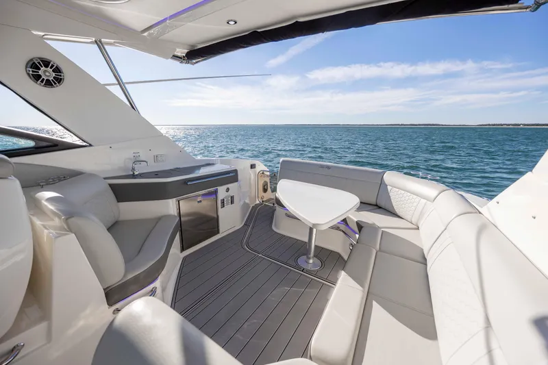 Slide: The Image of Luxurious 2020 Sea Ray Sundancer 320 Outboard yacht interior with ocean view and elegant seating. - 20