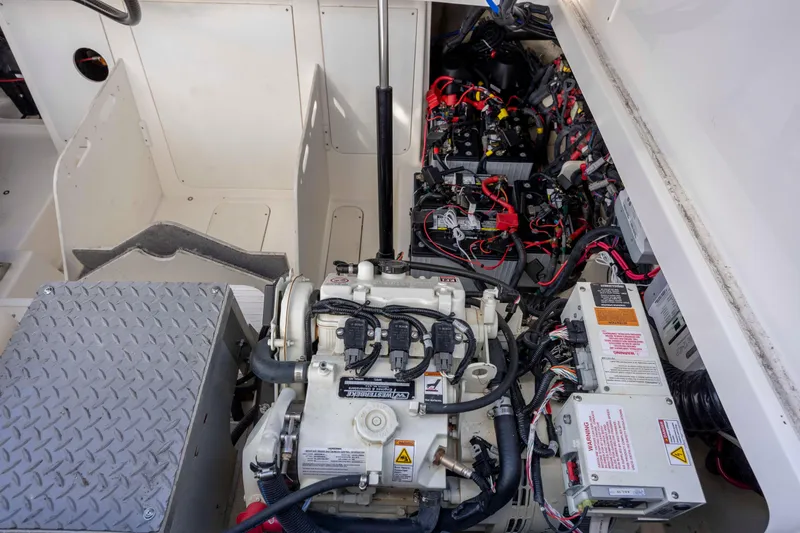 Slide: The Image of Engine compartment of 2020 Sea Ray Sundancer 320 Outboard with visible wiring and components. - 25