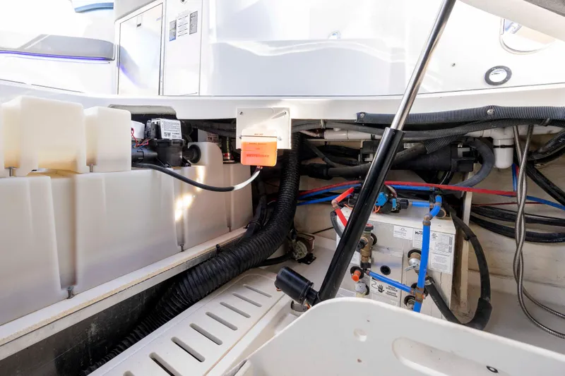 Slide: The Image of 2020 Sea Ray Sundancer 320 Outboard engine compartment with wiring and components. - 27