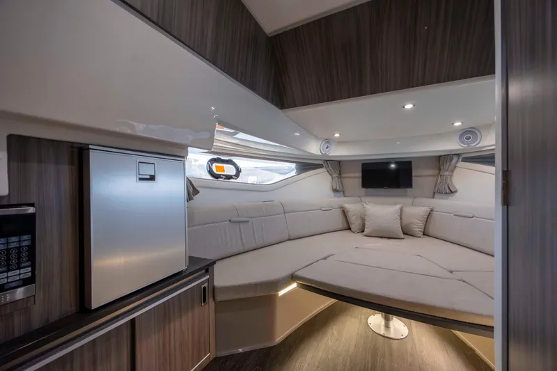 Slide: The Image of Interior of 2020 Sea Ray Sundancer 320 Outboard, featuring cozy seating and modern amenities. - 34
