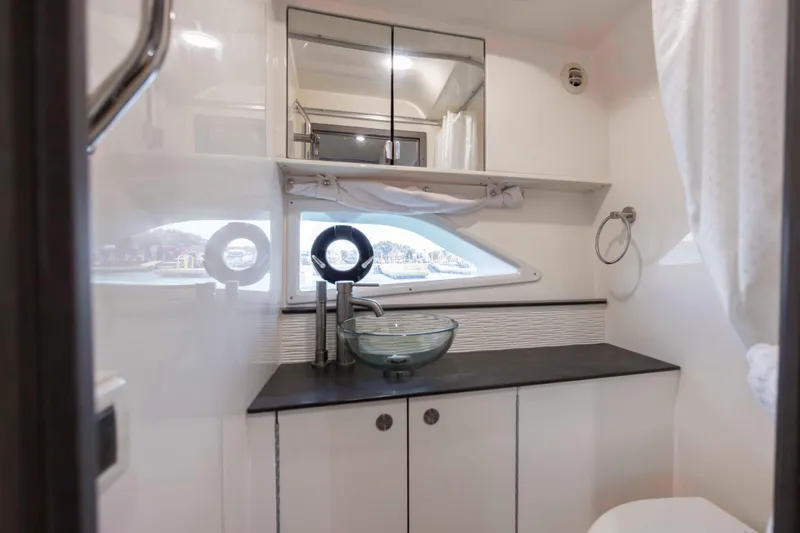 Slide: The Image of 2020 Sea Ray Sundancer 320 Outboard bathroom with modern sink and mirror. - 39
