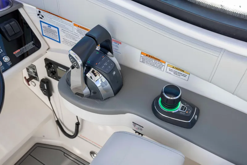 Slide: The Image of Control panel of 2020 Sea Ray Sundancer 320 Outboard with throttle and joystick. - 46