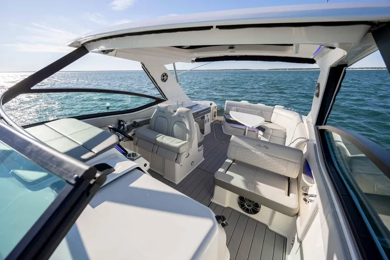 Slide: The Image of 2020 Sea Ray Sundancer 320 Outboard boat interior with luxurious seating on open water. - 48