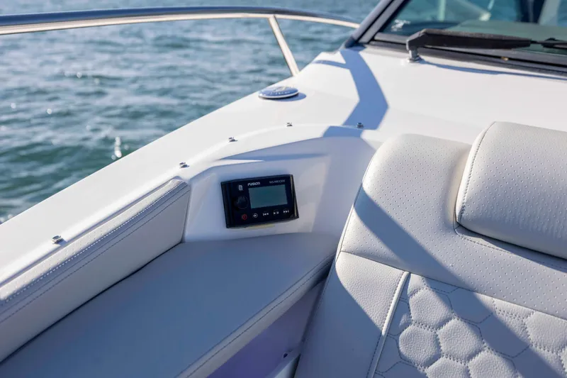 Slide: The Image of 2020 Sea Ray Sundancer 320 Outboard interior with Fusion stereo system, white leather seating, ocean view. - 54