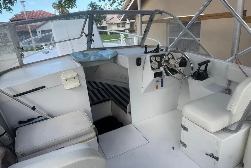 Slide: The Image of Interior of a 1962 Bertram 25 boat with helm station. - 2