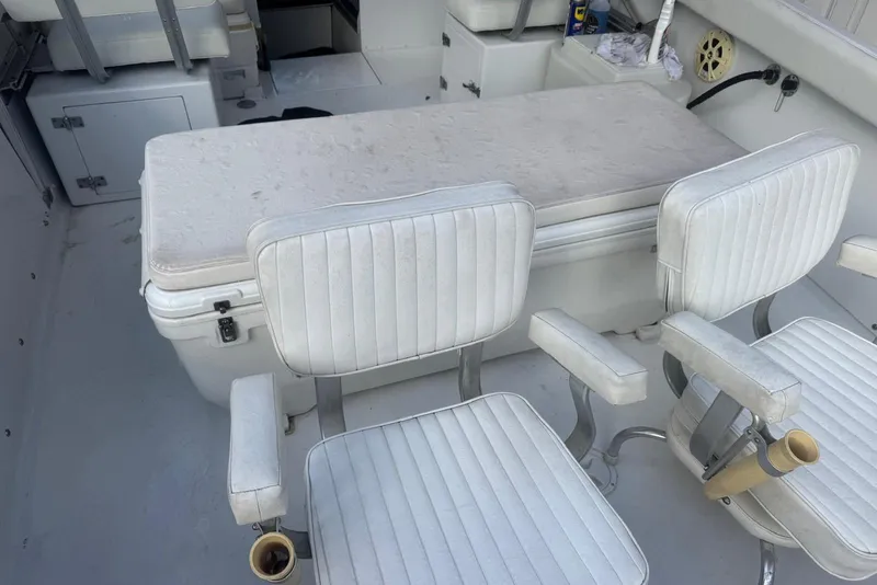 Slide: The Image of Interior of a 1962 Bertram 25 with white seating. - 3