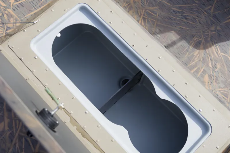 Slide: The Image of 2026 G3 Gator Tough 20 CC boat livewell interior view. - 11