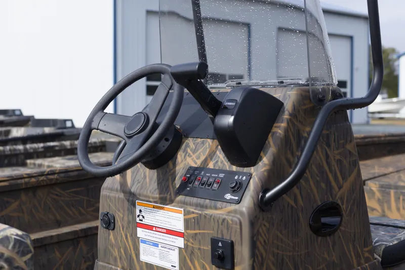 Slide: The Image of 2026 G3 Gator Tough 20 CC boat console with steering wheel and controls. - 5