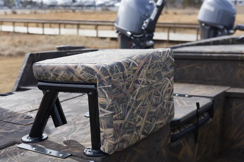 Slide: The Image of 2026 G3 Gator Tough 20 CC boat with camo seating and dual outboard motors. - 6