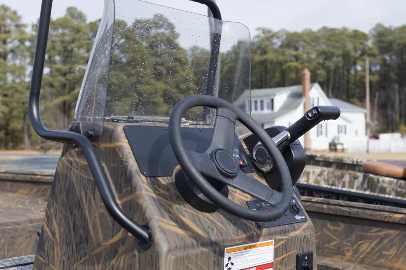 Slide: The Image of 2026 G3 Gator Tough 20 CC boat console with steering wheel and controls. - 9