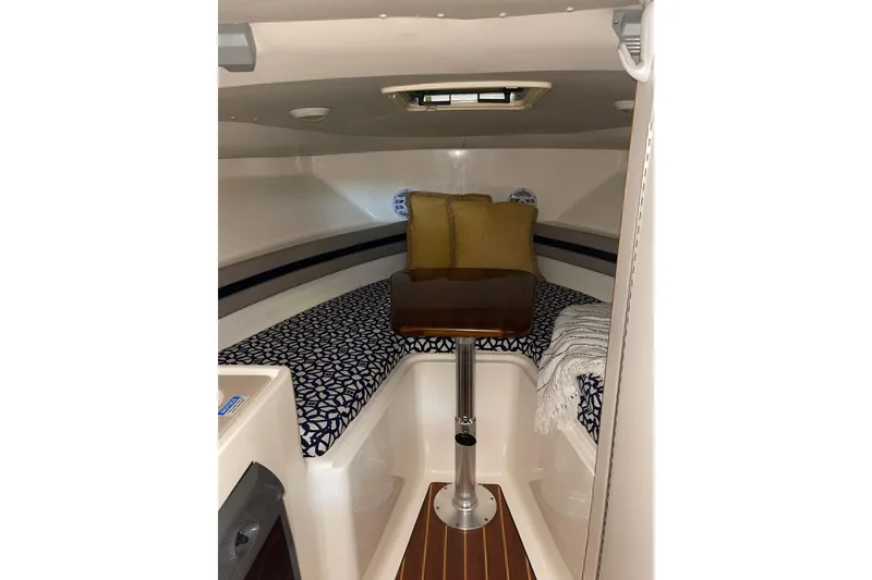 Slide: The Image of 2002 Pursuit 2860 Denali boat on trailer in indoor storage facility. - 7