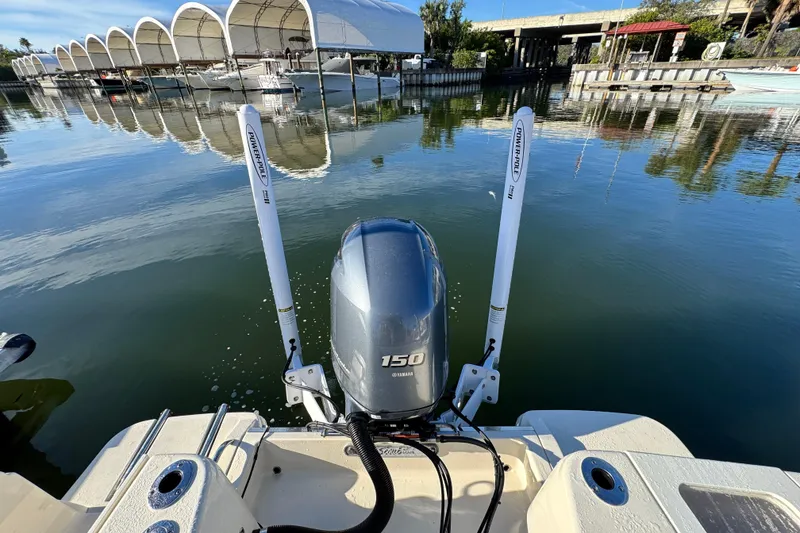 Slide: The Image of 2022 Scout 215 XSF boat with Yamaha 150 engine at marina dock. - 10