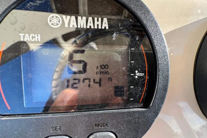Slide: The Image of Yamaha tachometer displaying 500 RPM on a 2022 Scout 215 XSF boat. - 26